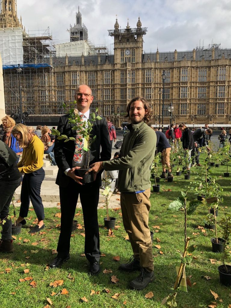 Sandy picking up his tree from Extinction rebellion organisers